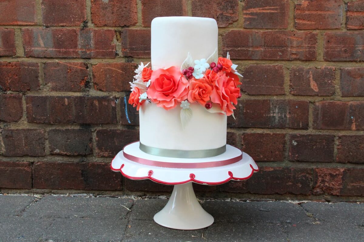 White fondant icing with floral decoration