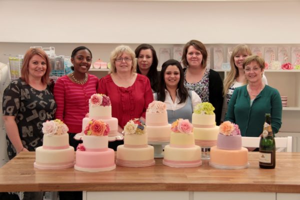 Students Displaying Cakes