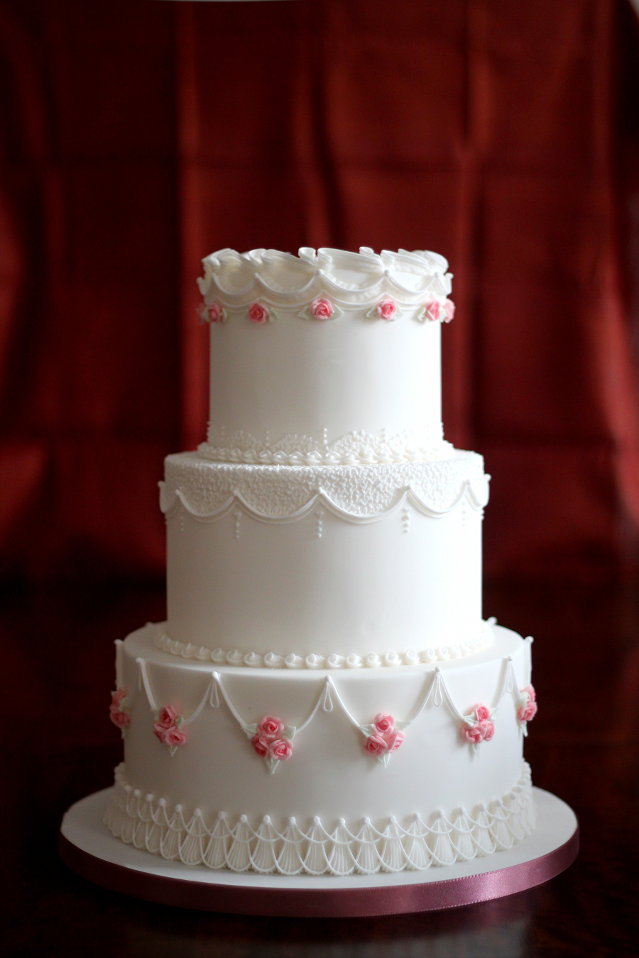 Three Tiered Wedding Cake with Red Background