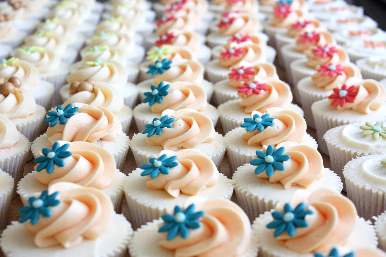 Swirl coloured decoration on cupcakes
